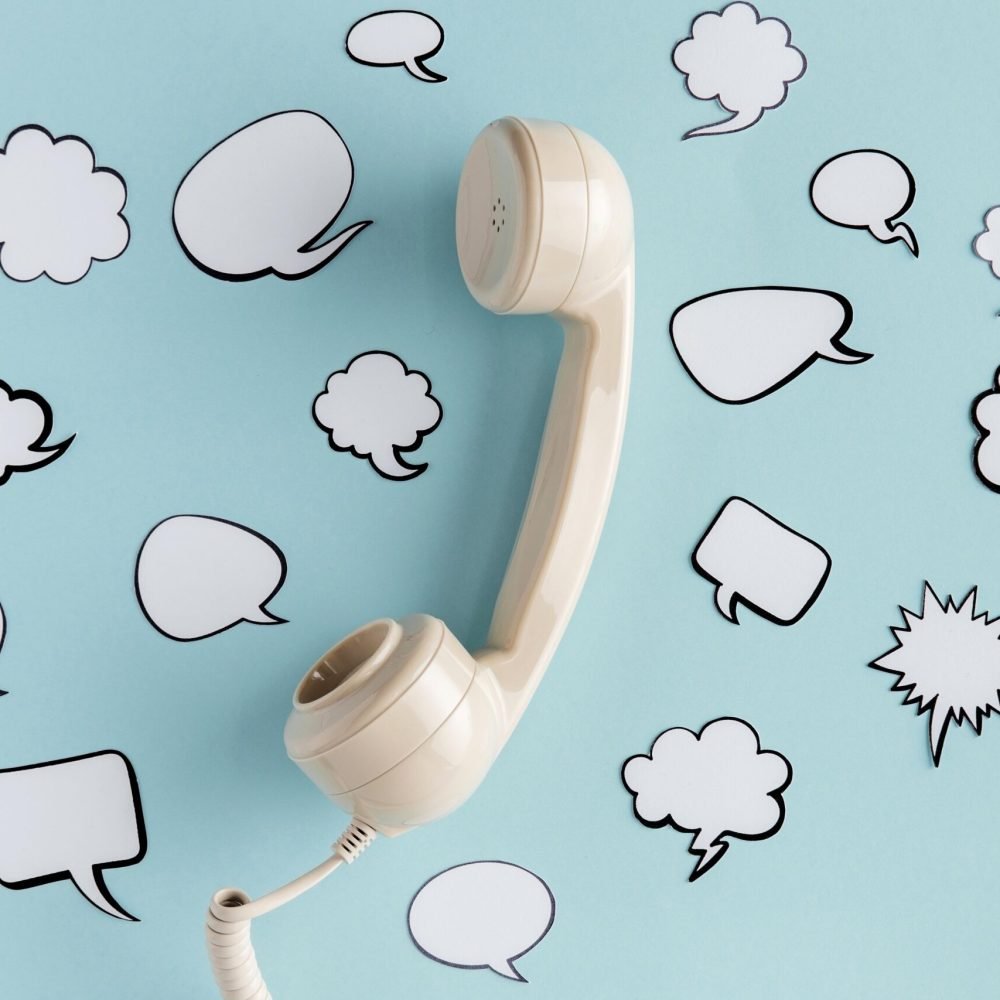 top-view-chat-bubbles-with-telephone-receiver